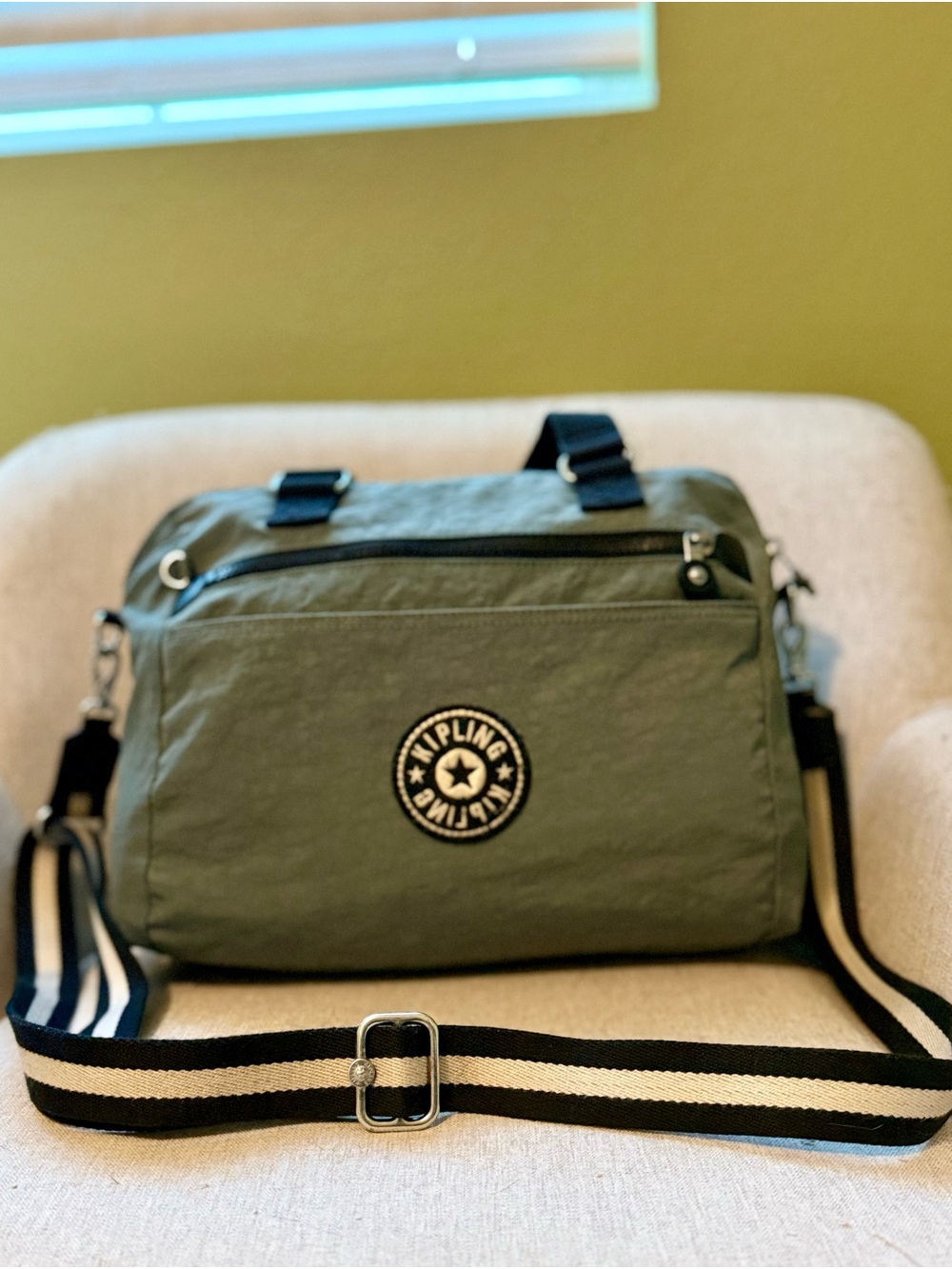 Kipling Olive Green pre-owned Messenger Bag with Black & Cream Striped Strap